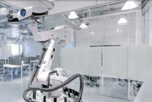 an ABB industrial robot arm performing an inspection task