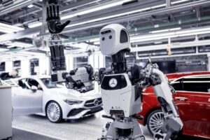 Apptronik's Apollo humanoid waving as it works in a BMW plant in Hamburg, Germany.