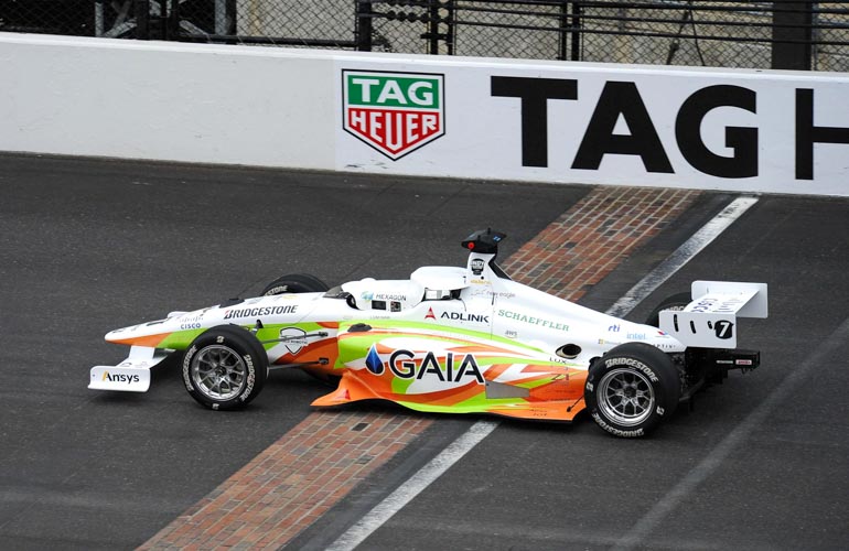 Indy Autonomous Challenge racecar crosses finish line at IMS.