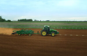 John Deere tractor at work in a field.